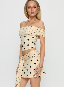   side view of model wearing Princess Polly Porzia Wrap Detail Mini Skirt Cream / Polka Dot Mini Skirts Skirts 