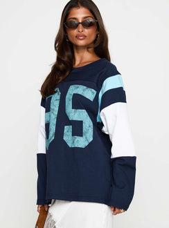 side view of model wearing Princess Polly Collegiate Queen Long Sleeved Top Navy Full Sleeves Crew Neck 