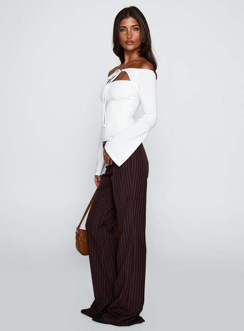 side view of model wearing Princess Polly Kinkirk Flared Pants Brown Pinstripe Low Rise Pants Pants 
