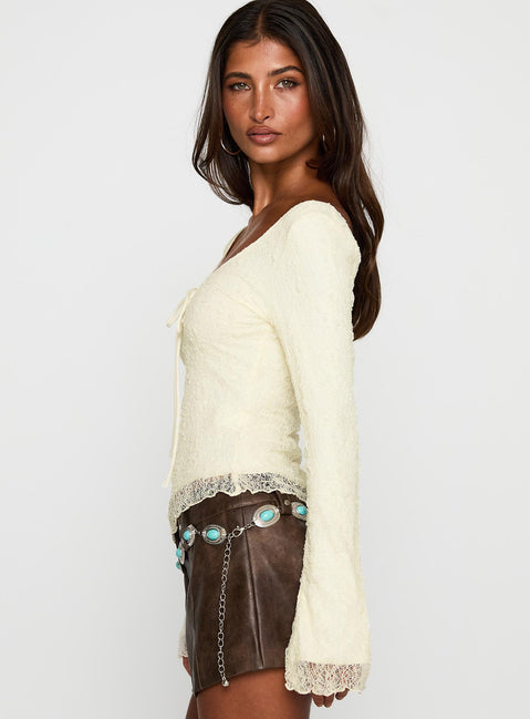 side view of model wearing Princess Polly Hyacinthe Long Sleeve Top Cream Full Sleeves Scoop Neck 