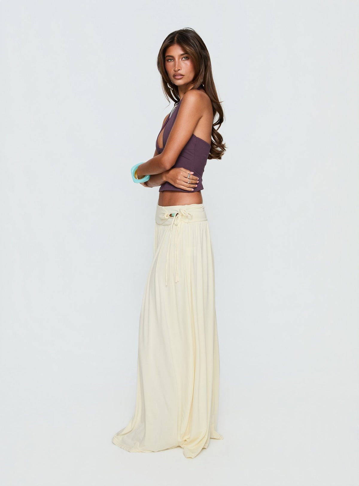   side view of model wearing Princess Polly Velvet Storm Tie Detail Flowy Maxi Skirt Cream Maxi Skirts Skirts 