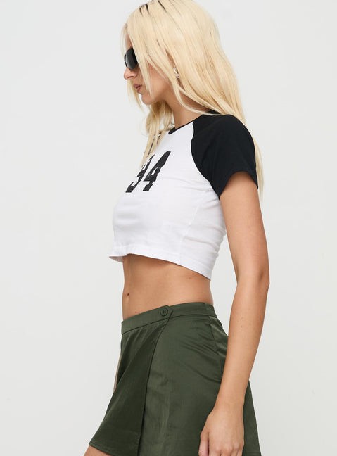 side view of model wearing Princess Polly Lucky Number Top White Short Sleeves Crew Neck 