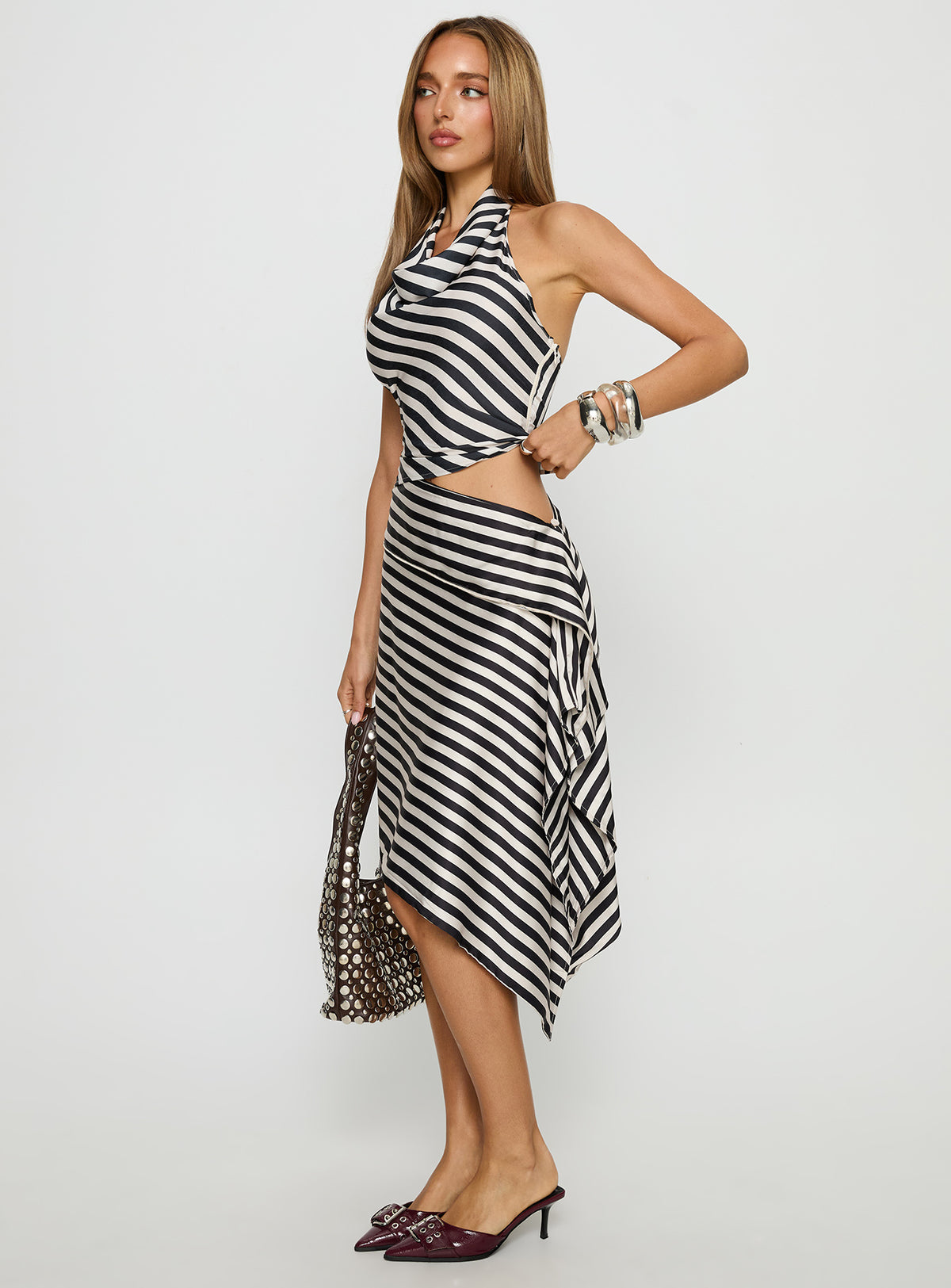   side view of model wearing Princess Polly Allure Midi Skirt Noir Stripe Midi Skirts Skirts 
