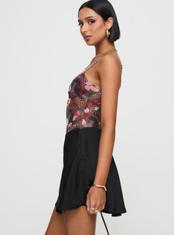  side view of model wearing Princess Polly Dapple Bias Satin Mini Skirt Black Mini Skirts Skirts 