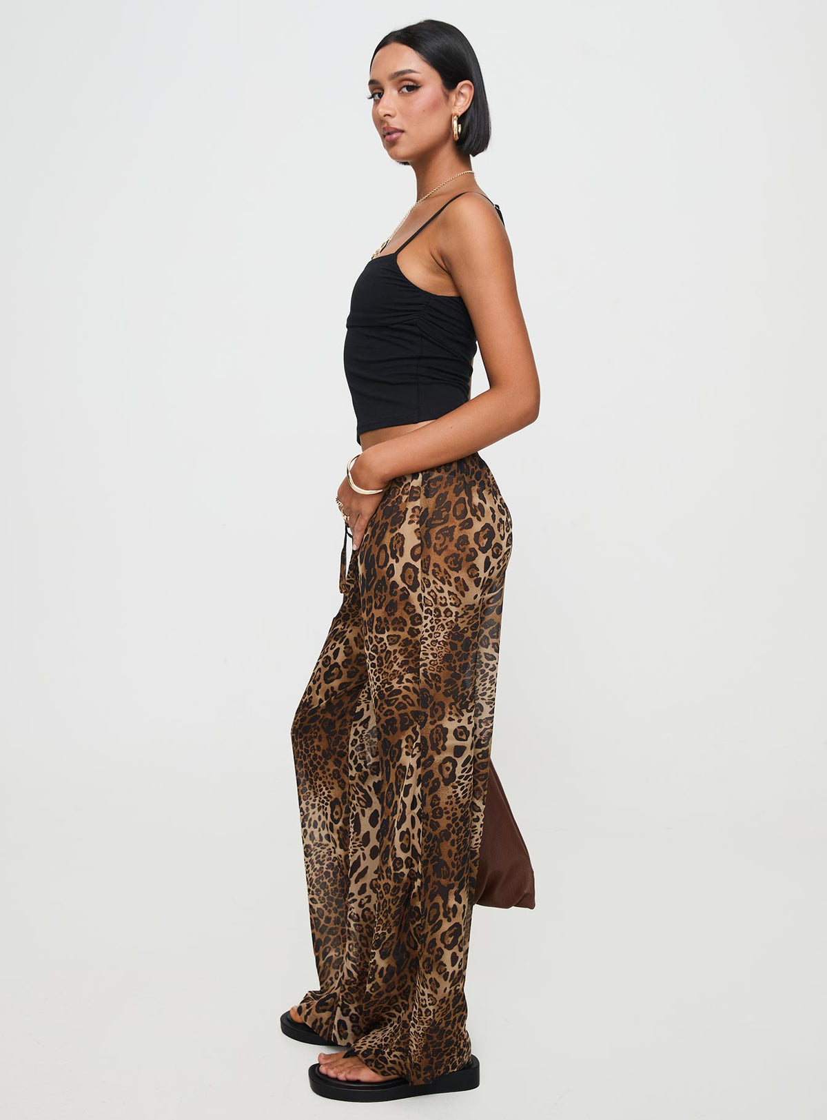 side view of model wearing Princess Polly Fyre Wide Leg Pant Leopard Petite Low Rise Pants Pants 