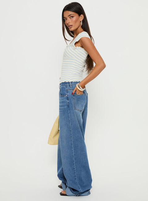 side view of model wearing Princess Polly Jacobie Mid Rise Wide Leg Jeans Mid Blue Wash Mid Rise Jeans Jeans 