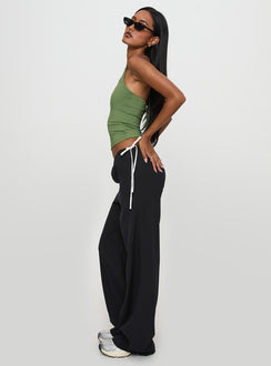 side view of model wearing Princess Polly Sweet As Sugar Bow Pants Black / White Pants 