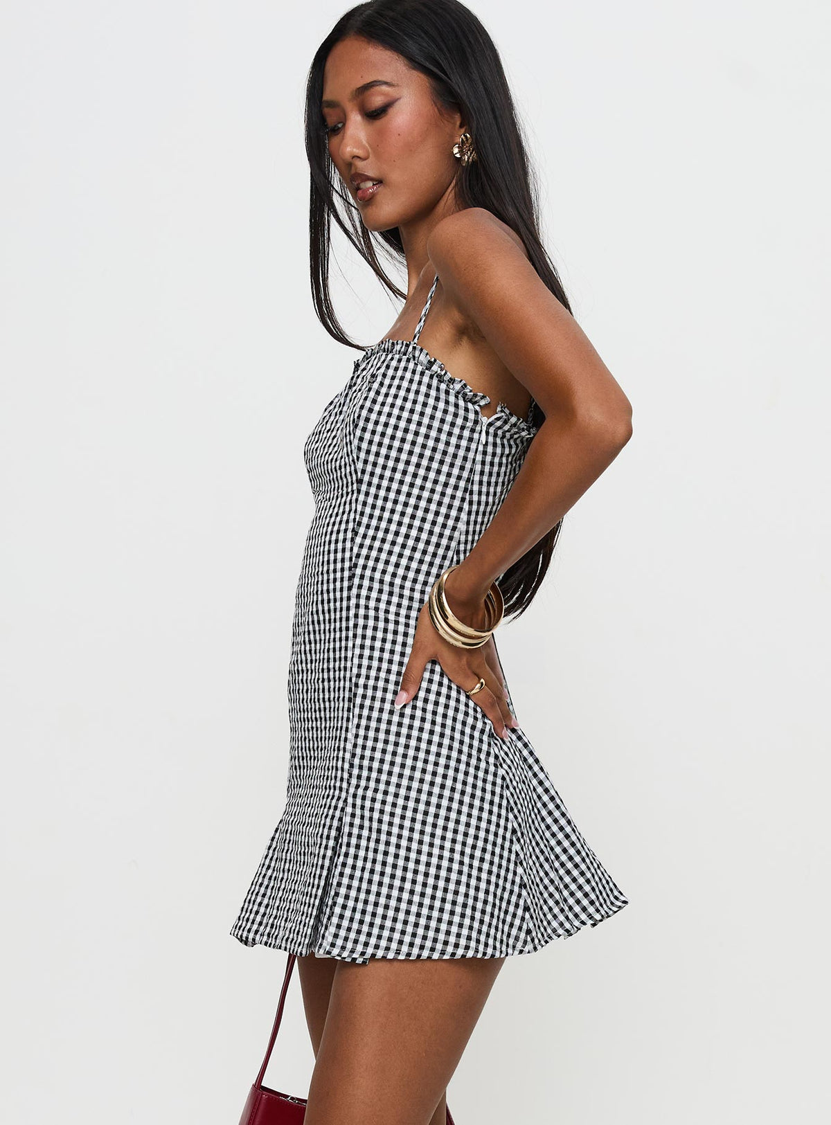 side view of model wearing Princess Polly Bessette Mini Dress Black Gingham Square Neck 