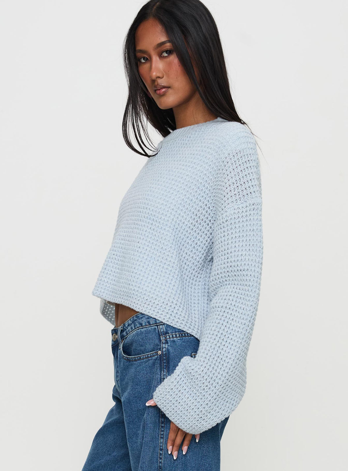 side view of model wearing Princess Polly Elinda Knit Sweater Blue Cropped Jumpers Jumpers 