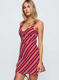 side view of model wearing Princess Polly Nadiah Mini Dress Red Stripe V-Neck 