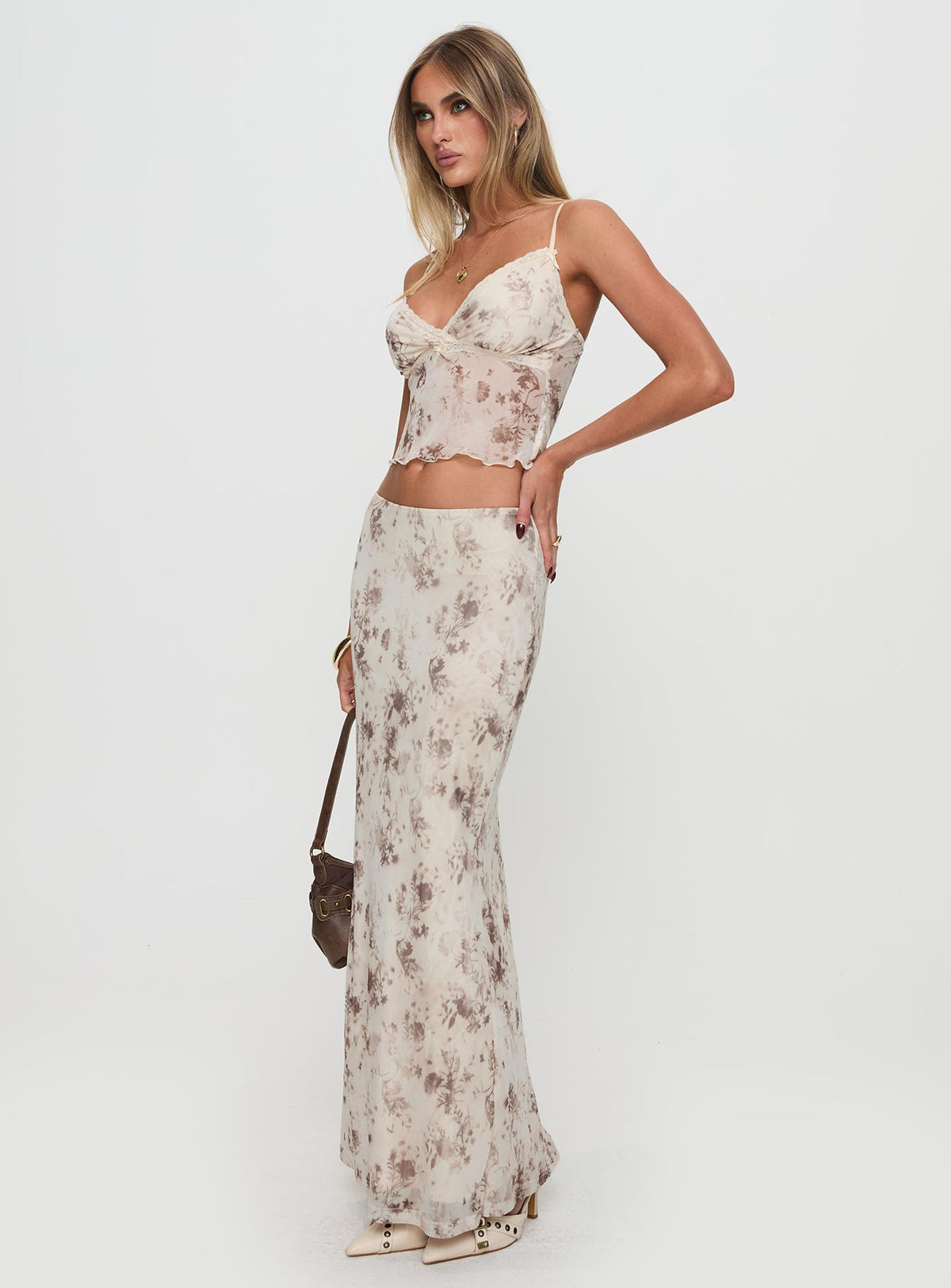 side view of model wearing Princess Polly Shepherd Top Floral Multi Sleeveless Plunger 