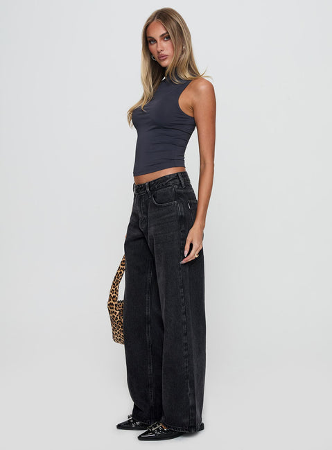 side view of model wearing Princess Polly Serenitia Mid Rise Relaxed Leg Jeans Washed Black Petite Mid Rise Jeans Jeans 