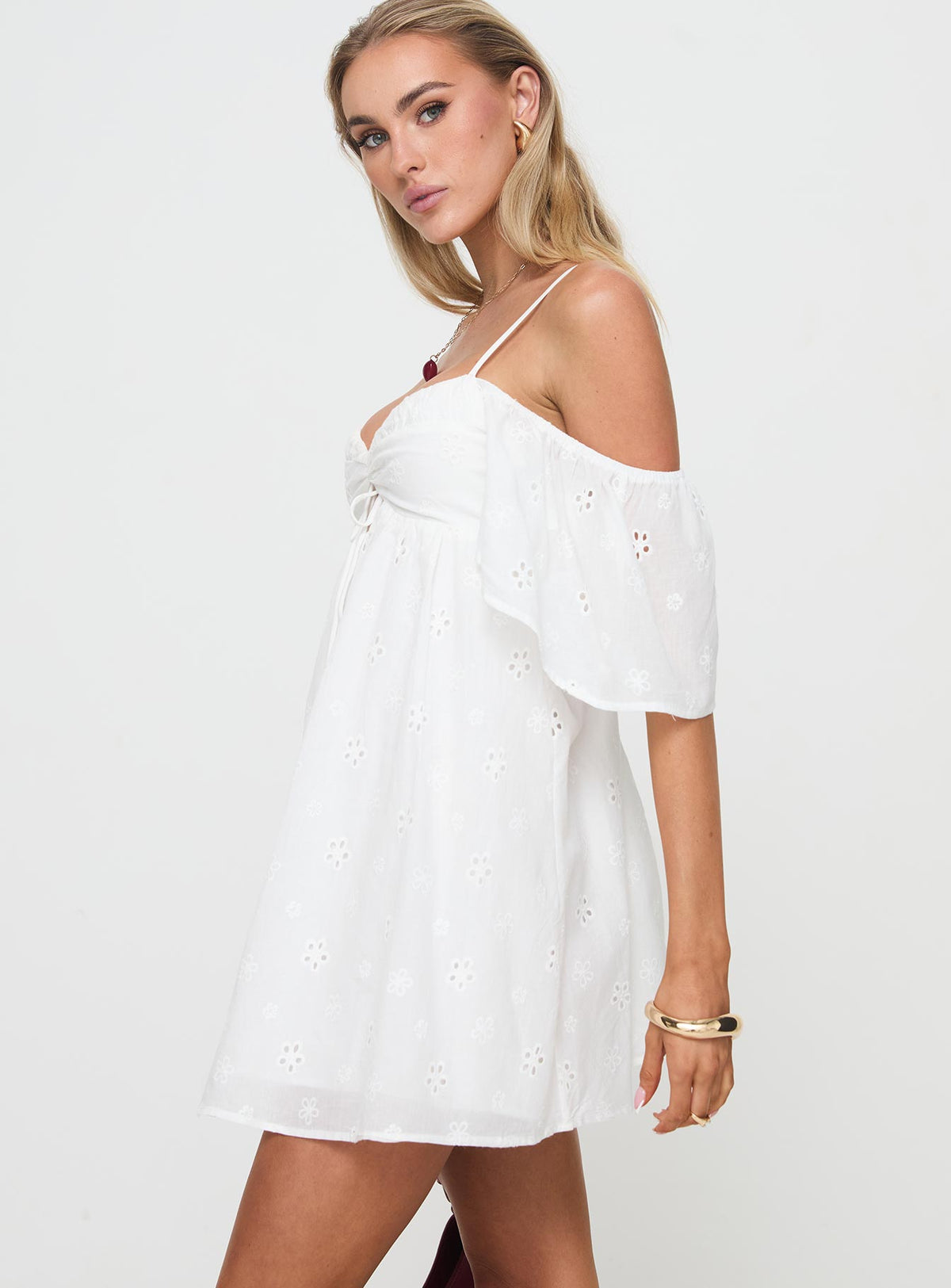 side view of model wearing Princess Polly Cene Mini Dress White Sweetheart Neckline 