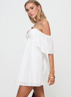 side view of model wearing Princess Polly Cene Mini Dress White Sweetheart Neckline 