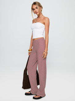 side view of model wearing Princess Polly Next To Me Lounge Pant Red / White Stripe Low Rise Pants Pants 