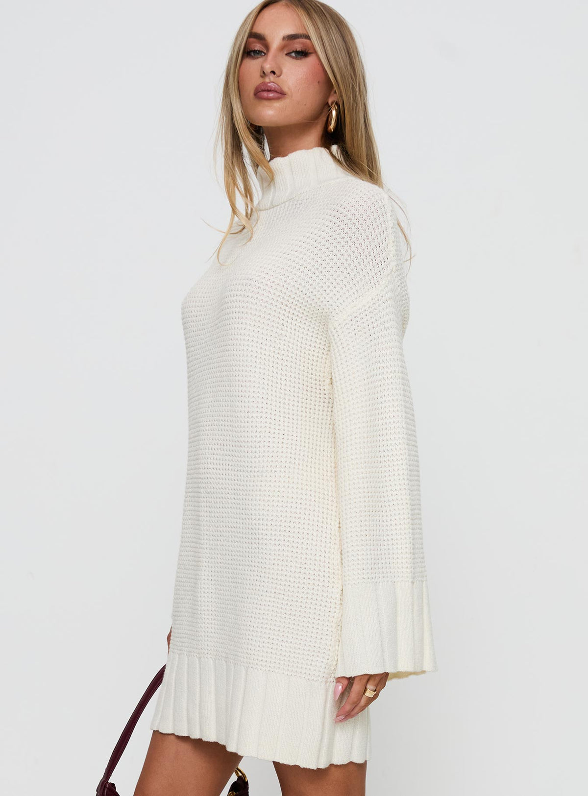 side view of model wearing Princess Polly Tarin Knit Mini Dress Cream High Neck 