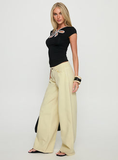 side view of model wearing Princess Polly Ramos Low Rise Wide Leg Denim Jeans Butter Lemon Low Rise Jeans Jeans 