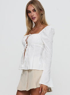 side view of model wearing Princess Polly Lilibette Tie Up Long Sleeve Top White Full Sleeves Square Neck 