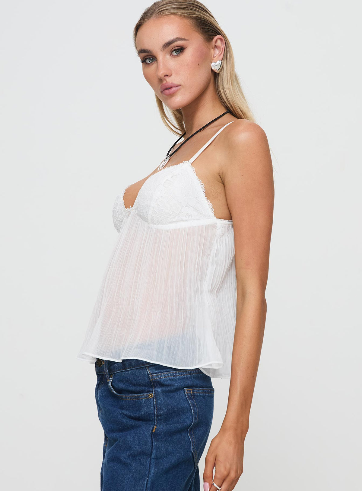 side view of model wearing Princess Polly Zami Pleat Top White Sleeveless Sweetheart 