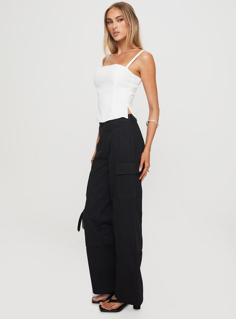 back view of model wearing Princess Polly Raider Low Waist Cargo Pant Black High Rise Pants Pants 