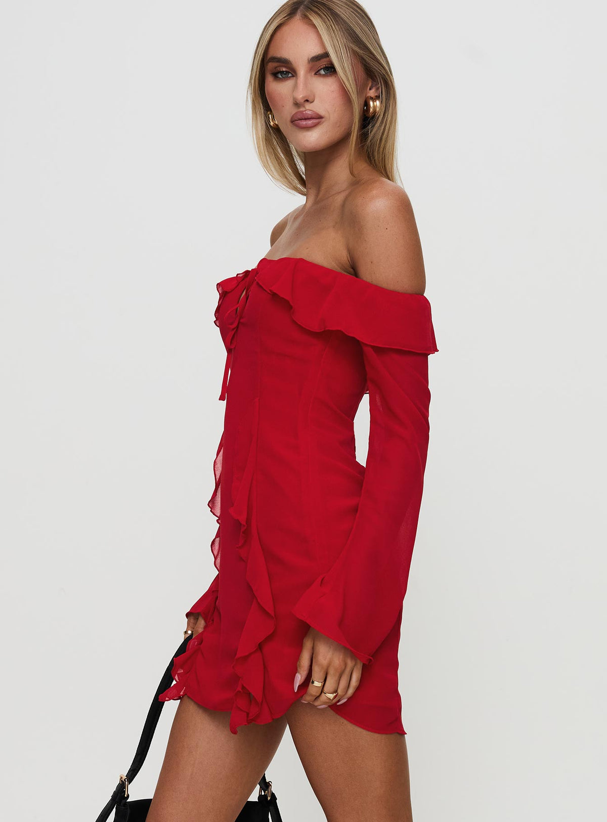 side view of model wearing Princess Polly Mollins Long Sleeve Mini Dress Red Straight Neck 