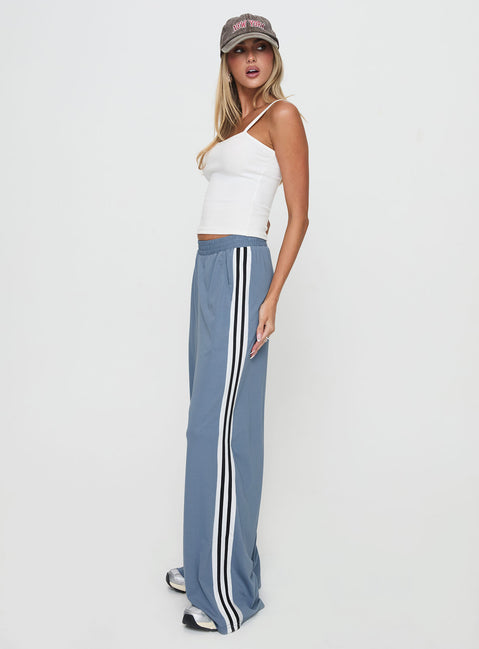 side view of model wearing Princess Polly Dime Track Pants Blue High Rise Pants Pants 