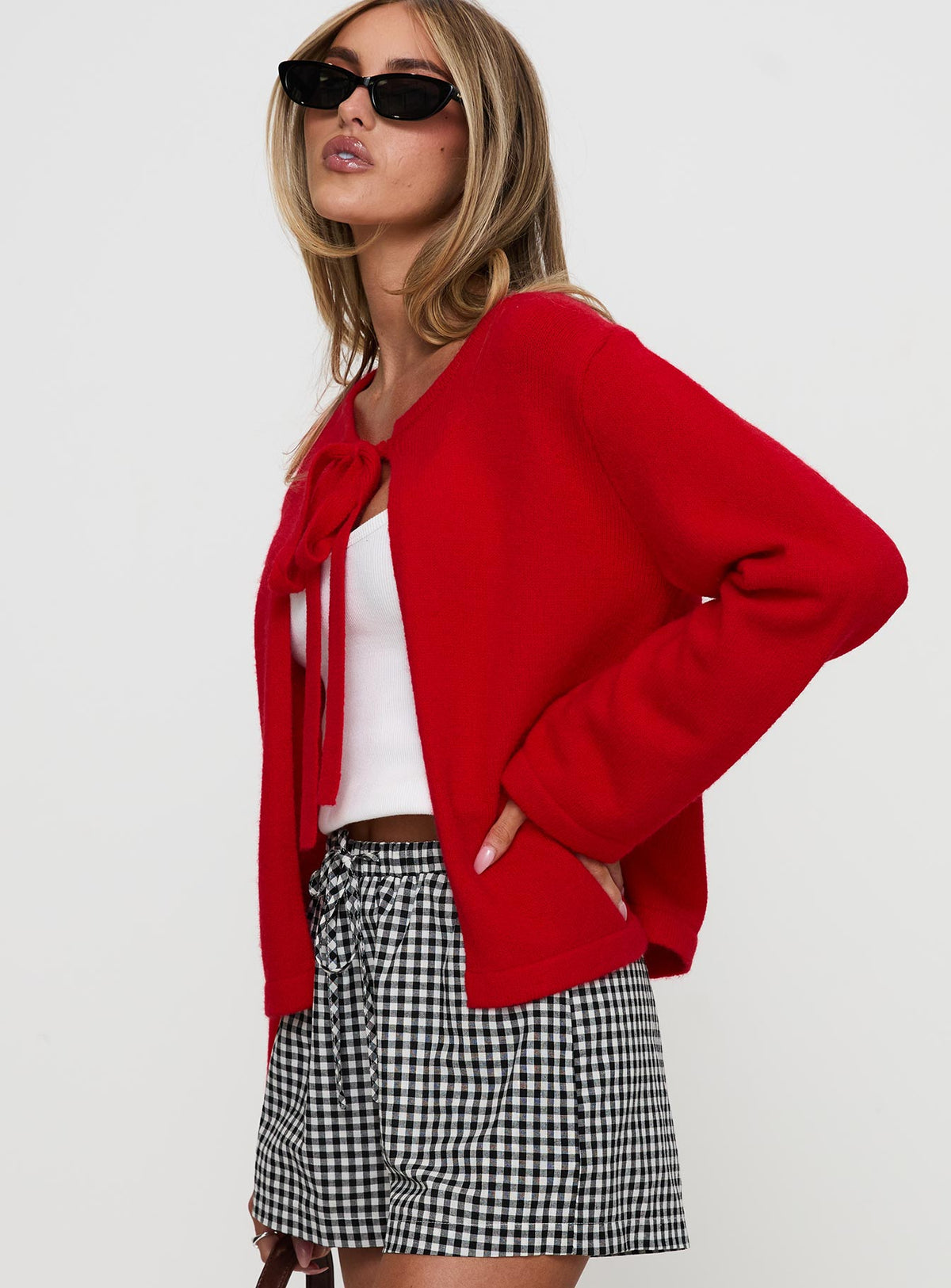 side view of model wearing Princess Polly Norine Tie Up Knit Sweater Red Cropped Jumpers Jumpers 