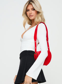 side view of model wearing Princess Polly Xander Long Sleeve Bodysuit White Long Sleeve Tops Bodysuit 