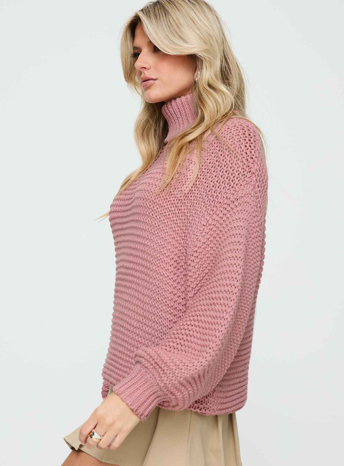 side view of model wearing Princess Polly Hayworth Turtle Neck Sweater Pink Longline Jumpers Jumpers 