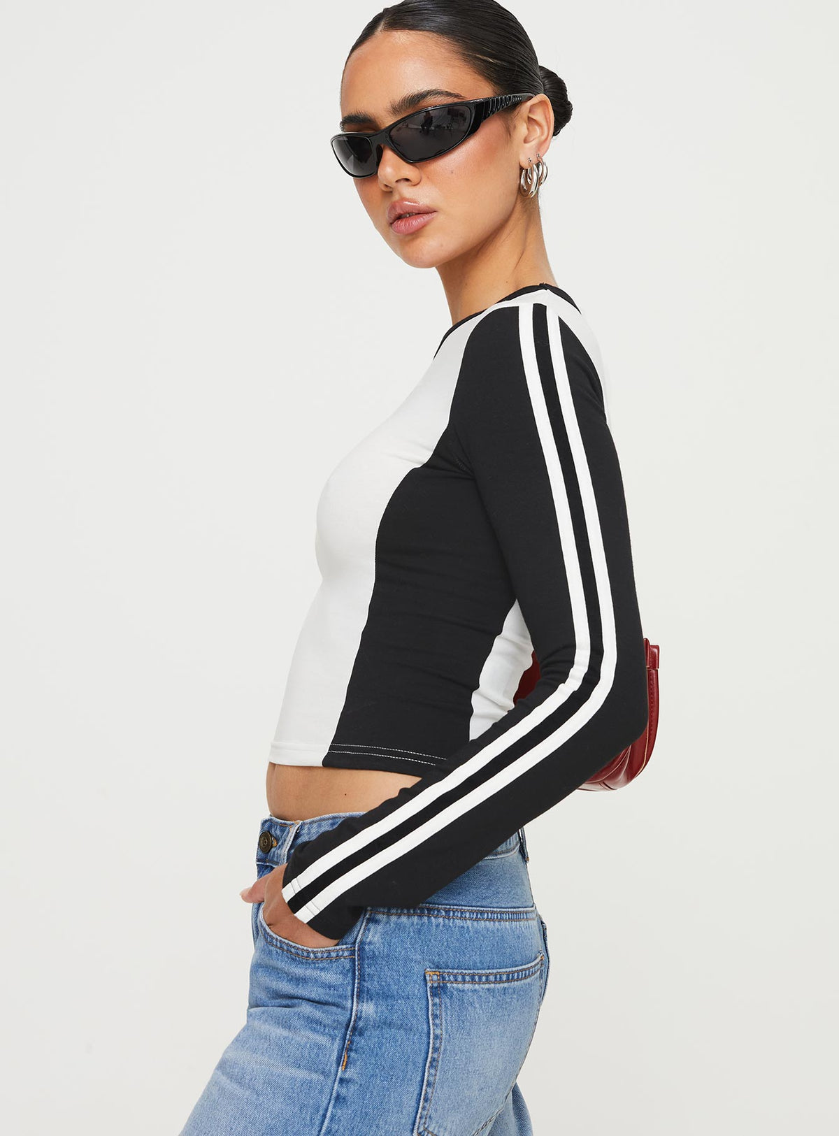 Front view of model wearing  front Princess Polly Sleeveless High Neck  Letina Long Sleeve Top Black / White
