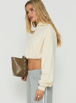 Showcasing the Mayse Bubble Hem Cropped Hoodie Cream womens jumpers in short length side view of model wearing Princess Polly