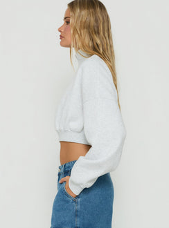 Designed with the Astridd 3/4 Zip Cropped Jumper Grey Marle womens jumper featuring short length side view of model wearing Princess Polly