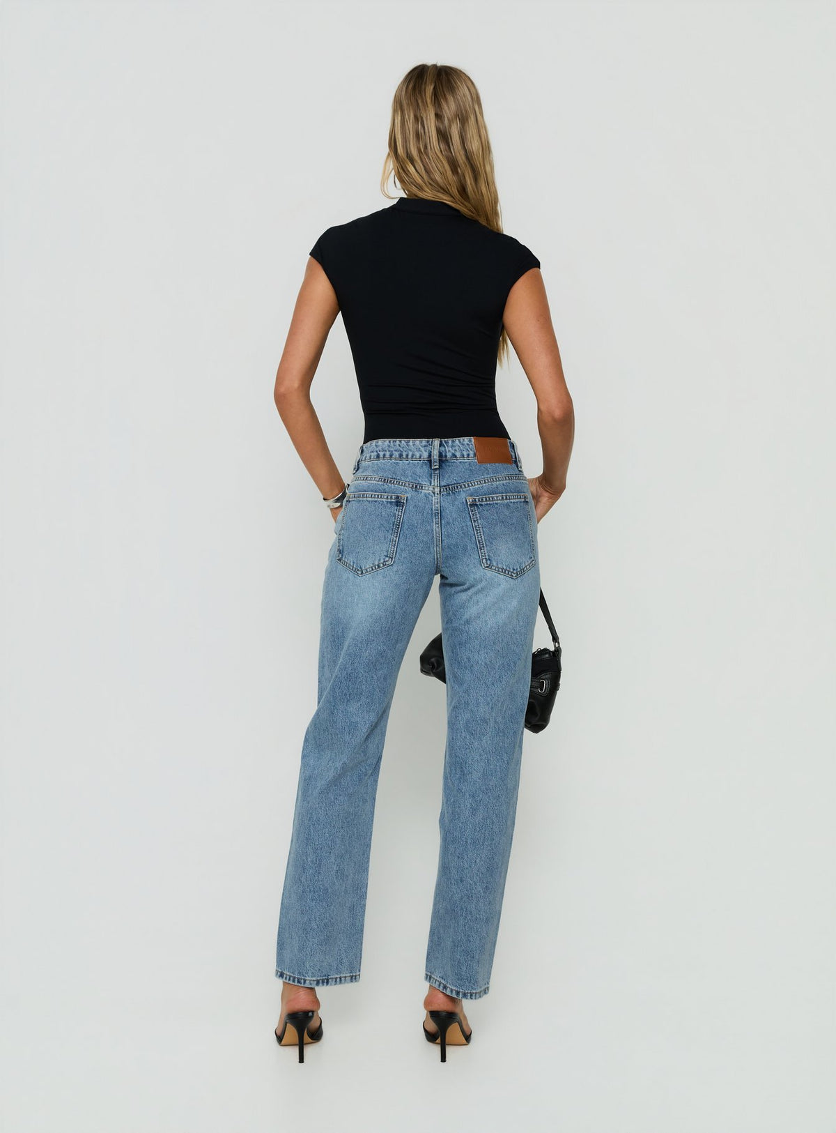 Designed with Fedela Mid Rise Straight Jeans Light Vintage Blue in womens-jeans featuring mid-rise waist back view of model wearing Princess Polly