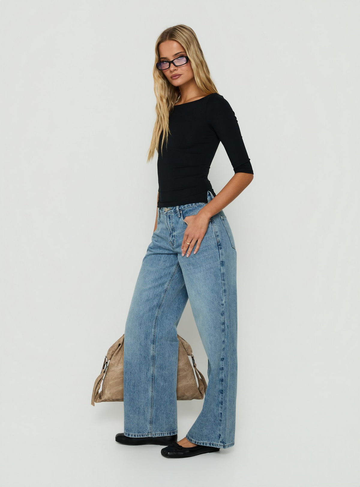 Designed with Serenitia Mid Rise Relaxed Jeans in Bright Blue womens-jeans featuring mid-rise waist side view of model wearing