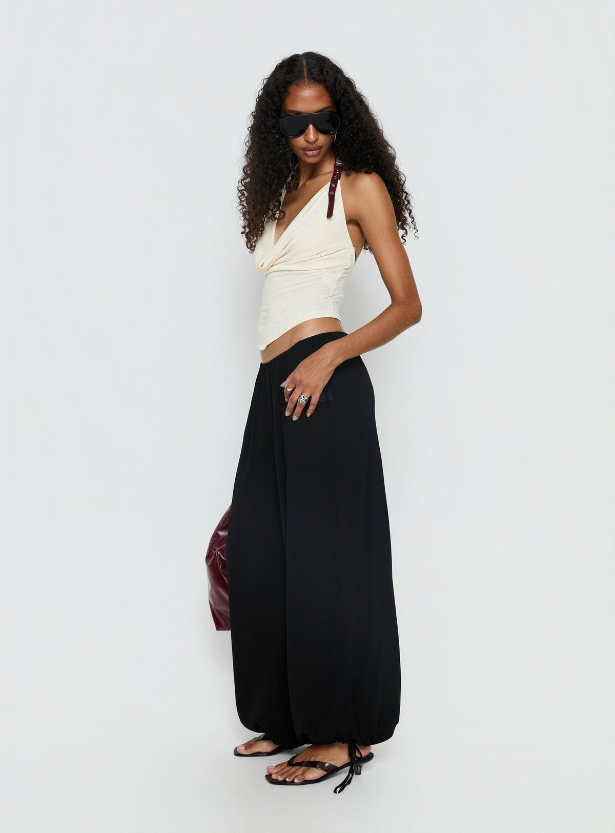 side view of model wearing Princess Polly Moondancer Balloon Pants Black Mid Rise Pants Pants 