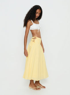   side view of model wearing Princess Polly Vence Ruched Maxi Skirt Lemon Yellow Maxi Skirts Skirts 