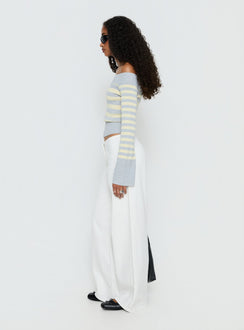 side view of model wearing Princess Polly Hereos Mid Rise Baggy Leg Jeans White Mid Rise Jeans Jeans 