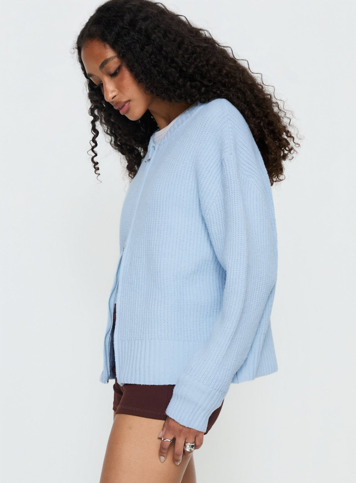 side view of model wearing Princess Polly Lexene Zip Through Jumper Baby Blue Longline Jumpers Jumpers 