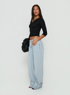 Featuring Ezia Wide Cuff Baggy Jeans Light Blue Wash in womens-jeans with high-rise side view of model wearing Princess Polly