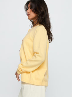 side view of model wearing Princess Polly Arica Button Up Knit Cardigan Lemon Longline Jumpers Jumpers 