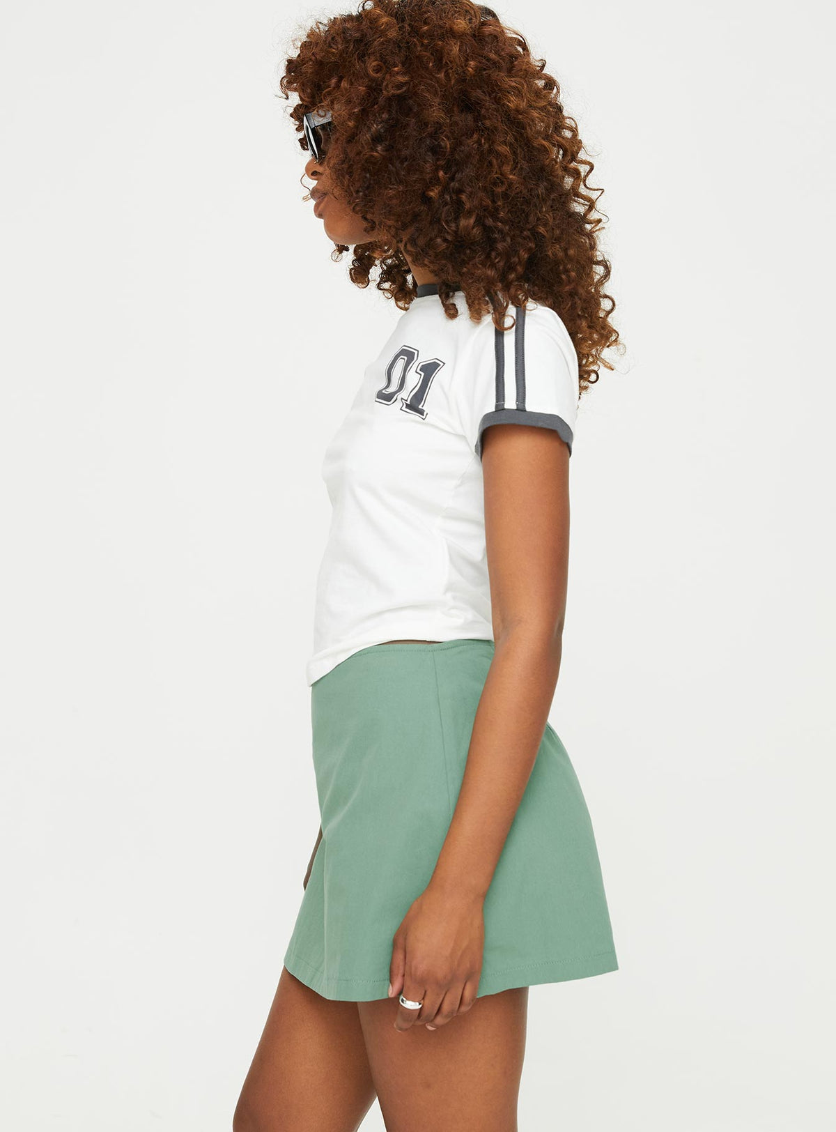 side view of model wearing Princess Polly Gigi Skort Olive High Waisted Shorts 