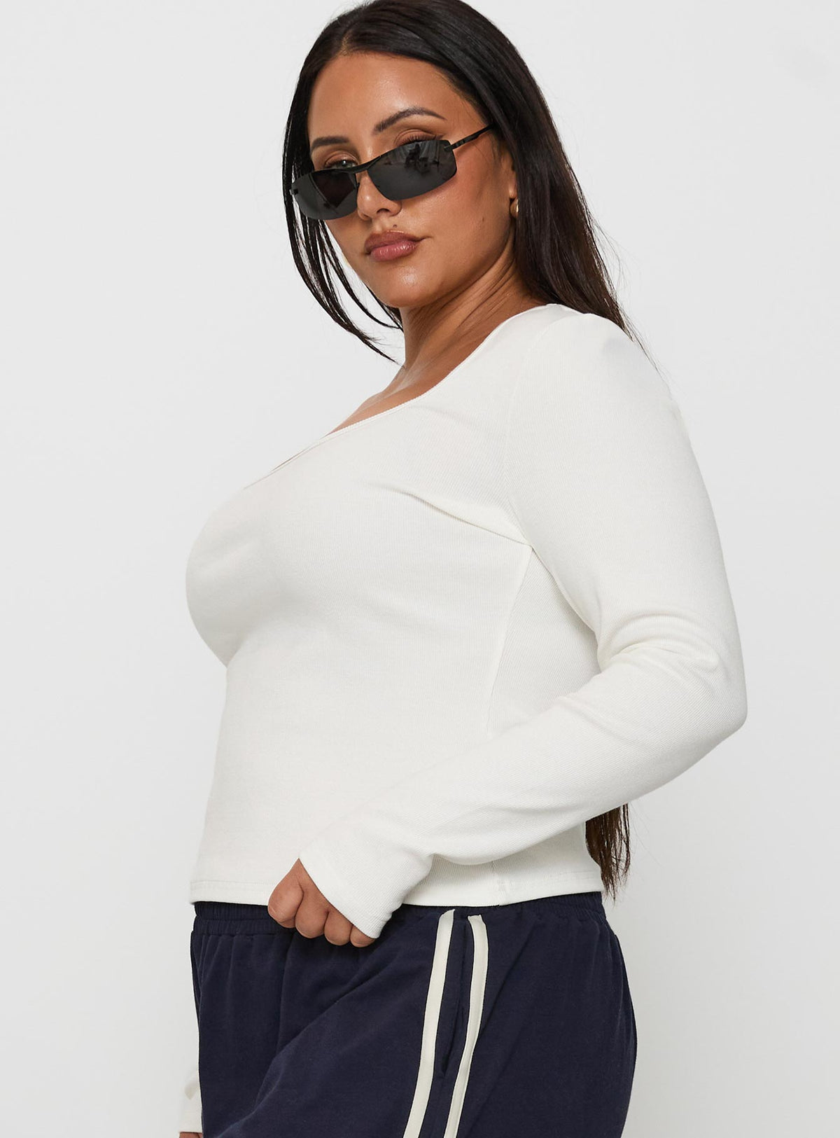 side view of model wearing Princess Polly Baseline Long Sleeve Top White Curve Full Sleeves Square Neck 