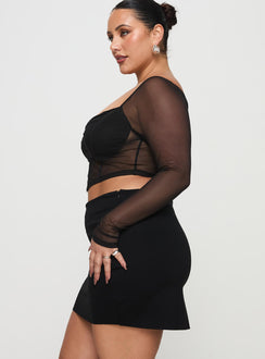   side view of model wearing Princess Polly Karley Low Waist Mini Skirt Black Curve Mini Skirts Skirts 