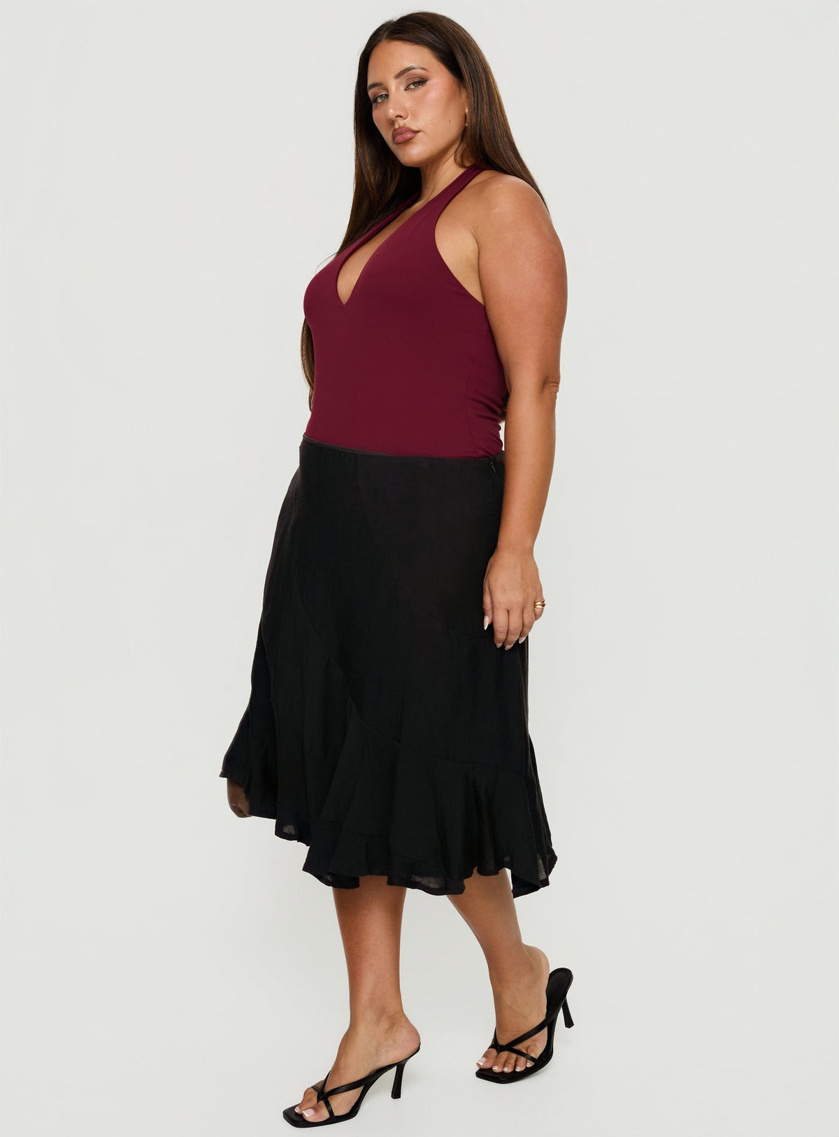   side view of model wearing Princess Polly With Kindness Midi Skirt Black Curve Midi Skirts Skirts 