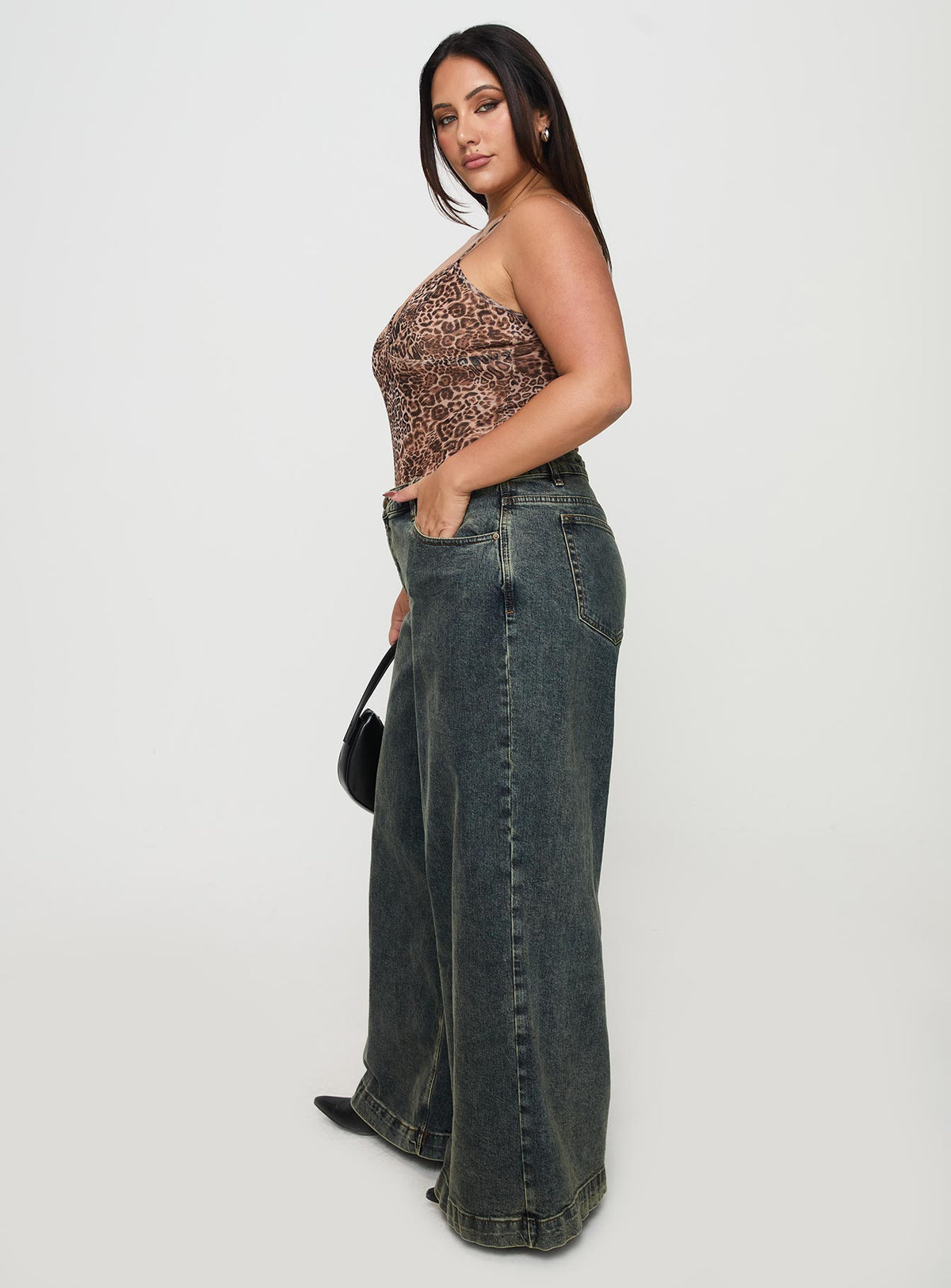 side view of model wearing Princess Polly Ziggie Low Rise Baggy Jeans Antique Wash Curve High Rise Jeans Jeans 