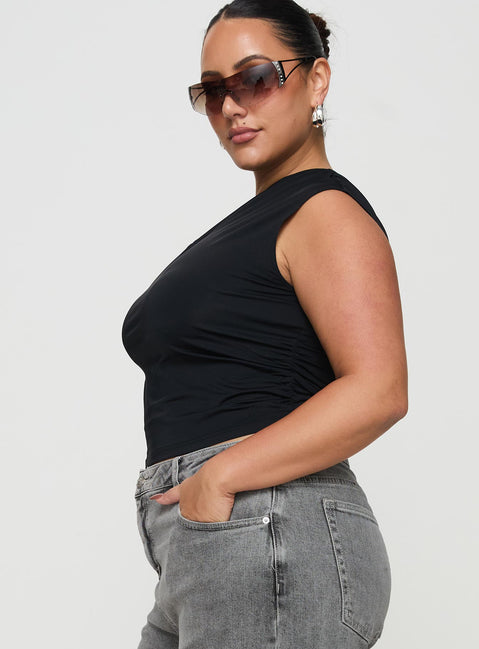 side view of model wearing Princess Polly Ander Top Black Curve Short Sleeves Asymmetric Neckline 