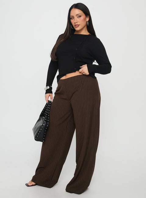 side view of model wearing Princess Polly Khane Low Rise Wide Leg Pant Brown Pinstripe Curve Low Rise Pants Pants 