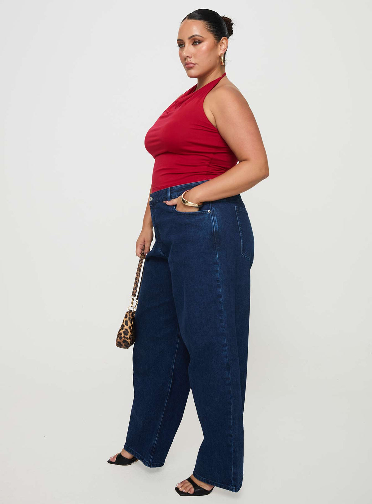 side view of model wearing Princess Polly Britta Mid Rise Tapered Leg Jeans Dark Wash Curve High Rise Jeans Jeans 