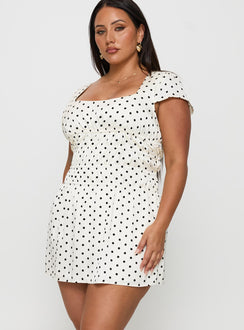 side view of model wearing Princess Polly Evangelie Ruched Mini Dress White Polka Curve Square Neck 