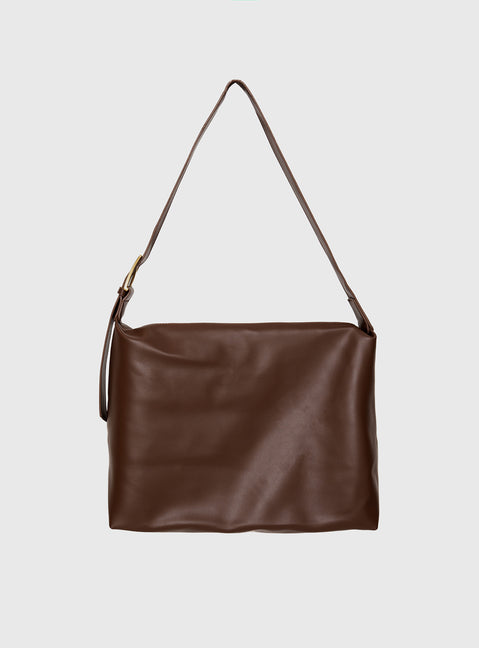 Faux leather bag  Adjustable shoulder strap, gold-toned buckle, single internal pocket with zip fastening, fully lined